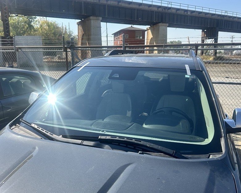 Auto glass service on a customer vehicle